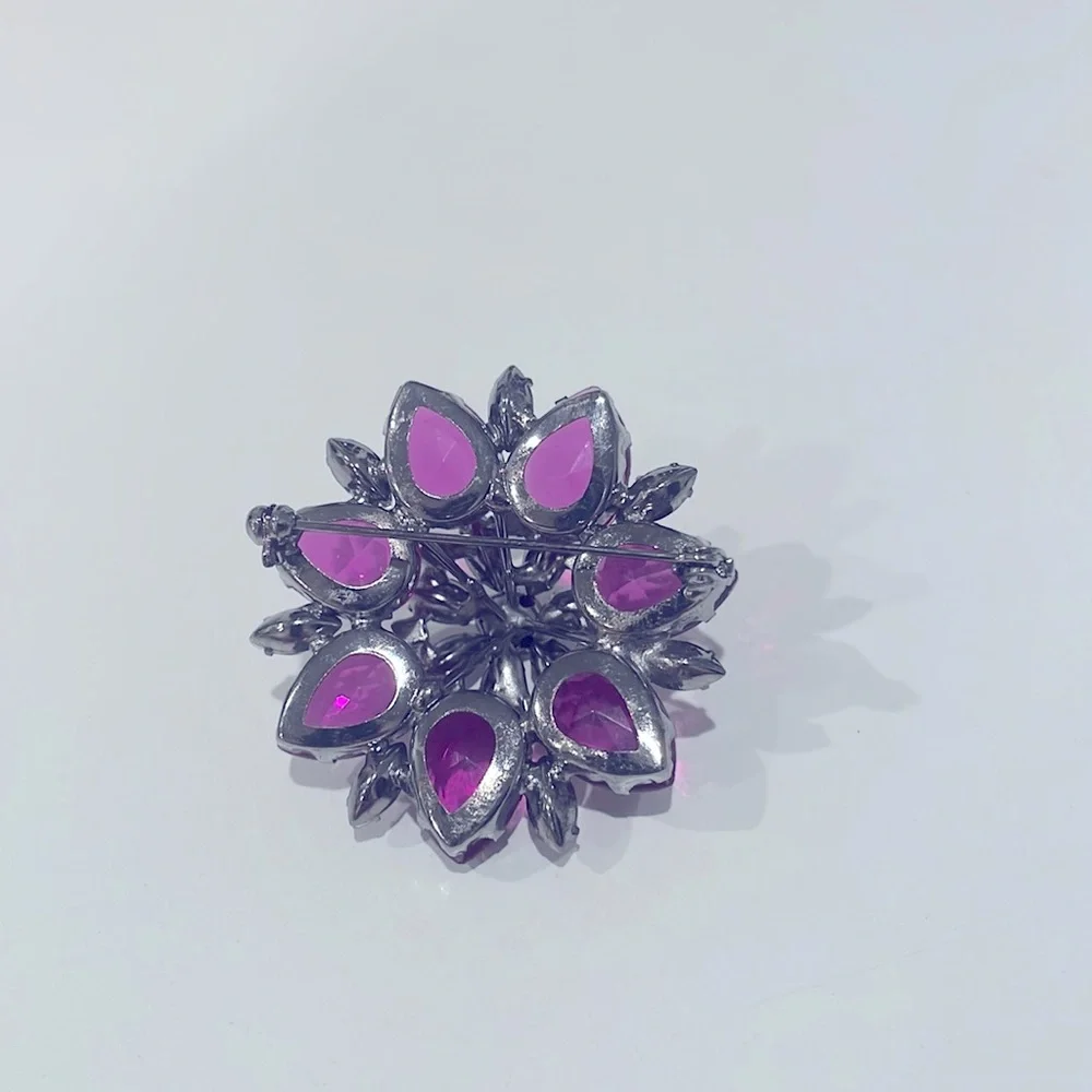 Pretty costume flower pin in pinks and purples. New.